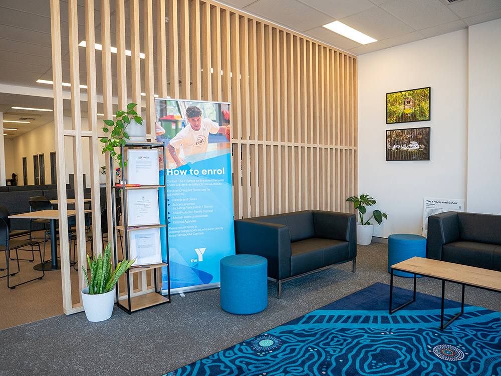 Foyer with signage and seating area at the Y School Mirrabooka 10-12 Campus