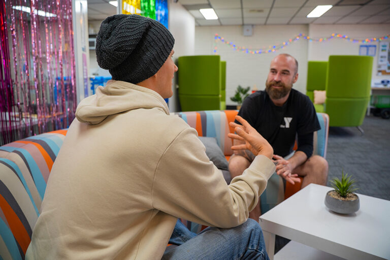 Youth worker engaging with a young person in a youth centre