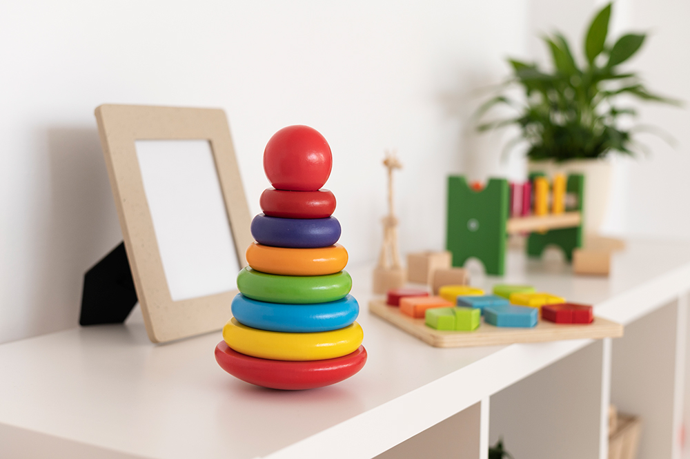 Shelf with colourful toys and blocks on it