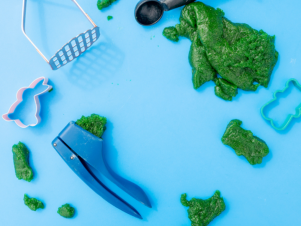 Close up image of play-dough and other utensils for sensory play