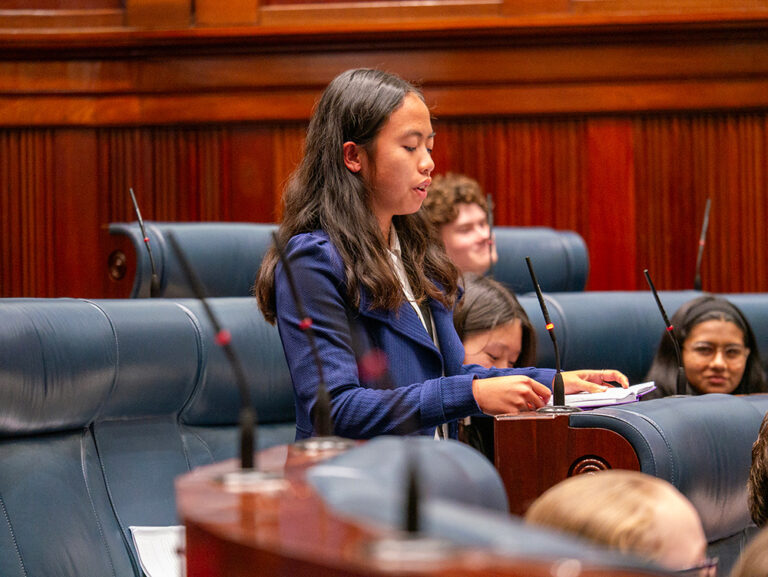 Young woman giving a speech in the chamber at West Australian Parliament House