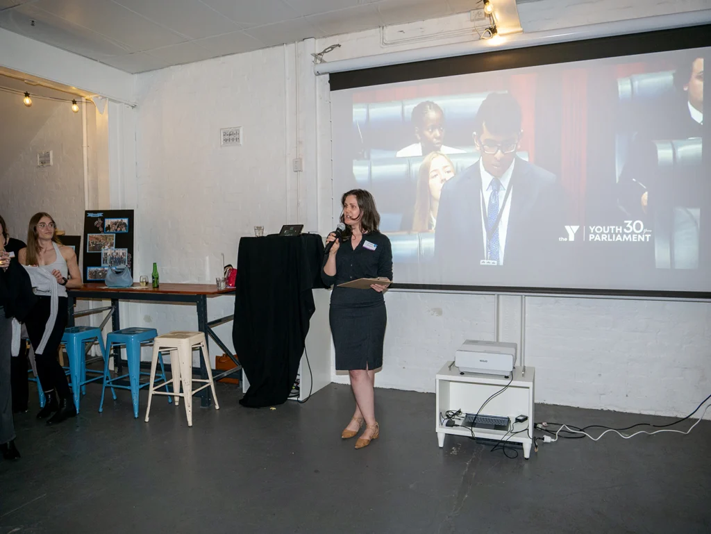 Youth parliament alumni member presenting at 30 year alumni event for youth parliament